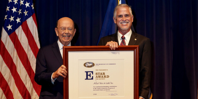 Owner Tim Flynn receiving the Presidential "E" Star Award - 2018