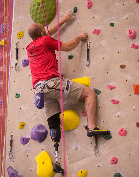 Salesman Tommy Lyon at OPAF adaptive climbing event